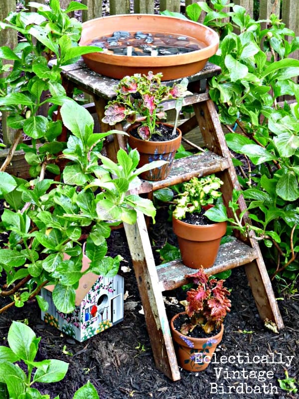 Bird bath made out of a step ladder